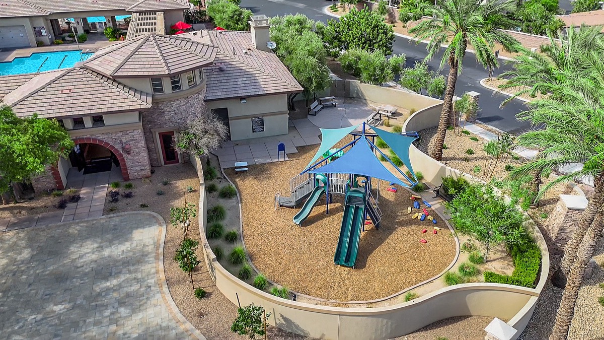 Shaded children's playground inside the Southern Terrace clubhouse grounds